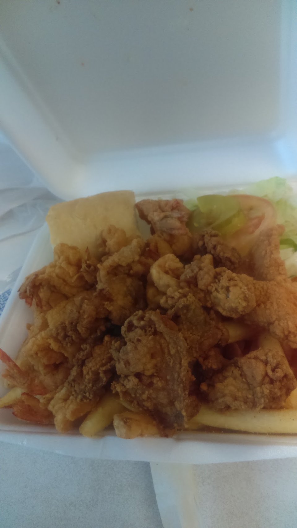 Printed menu showing salads and fried chicken.